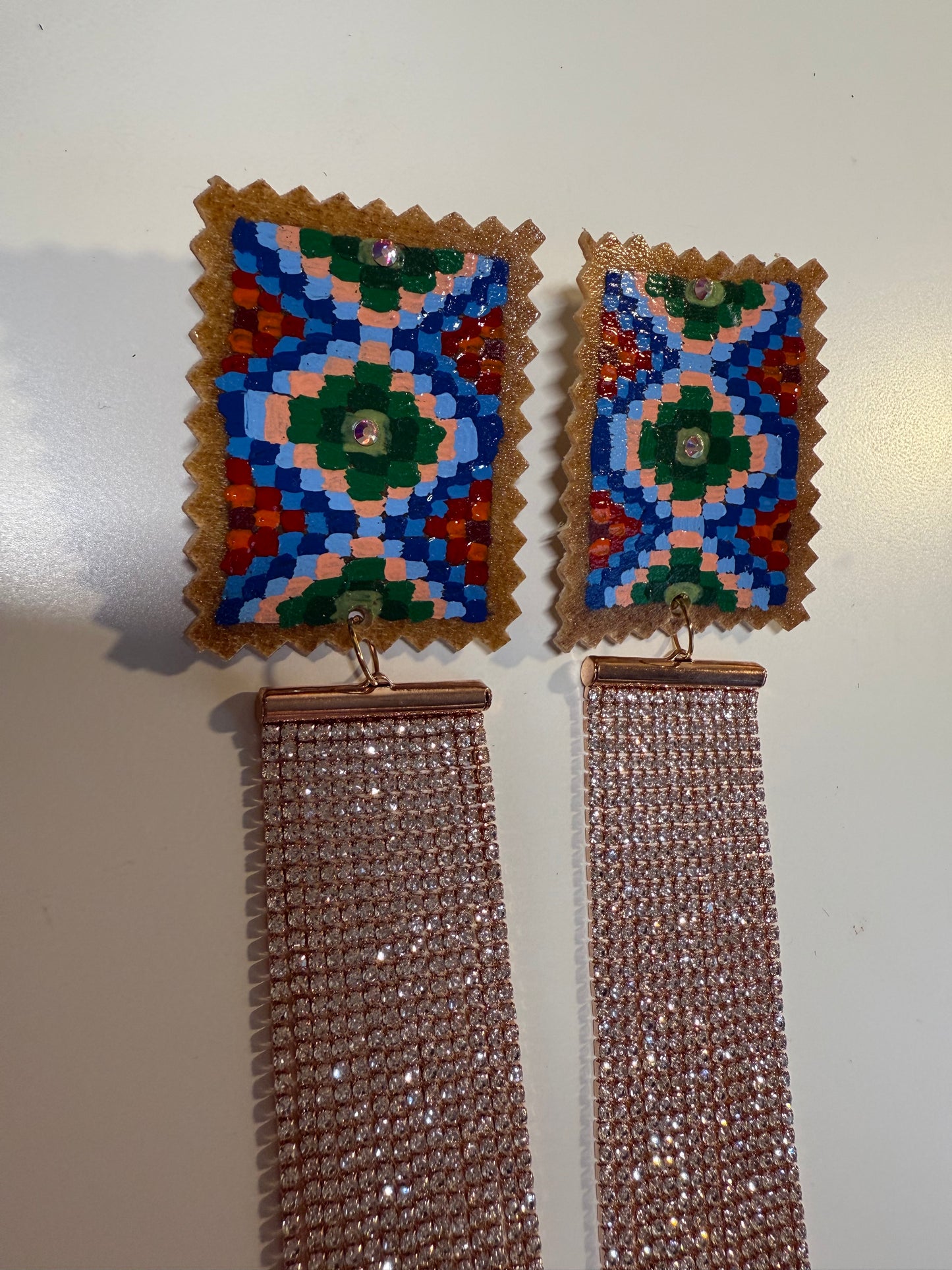 Hand painted earrings with gem drops.